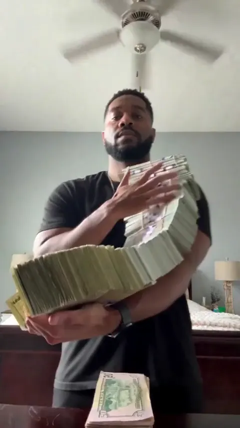 Money Flex AI video, part 1: Arms full of cash